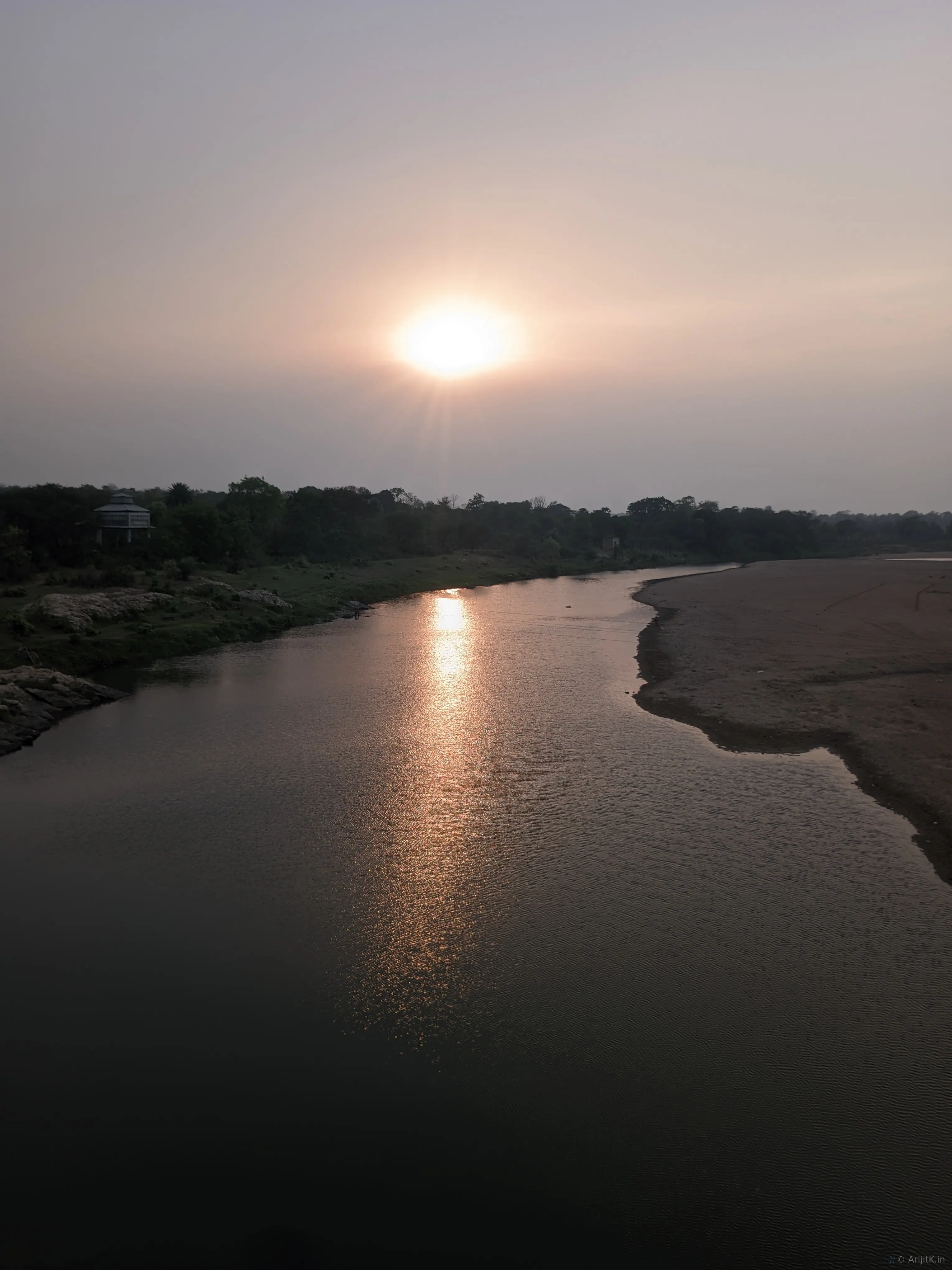 The Dwarakeswar River with reflections on the water surface