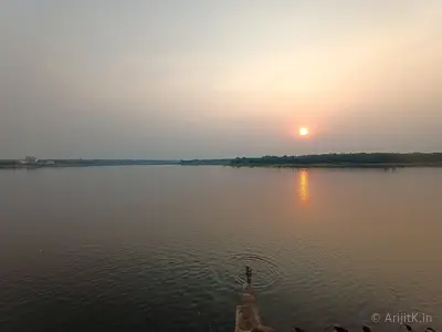Futiyari Dam reservoir with calm water reflecting the sky