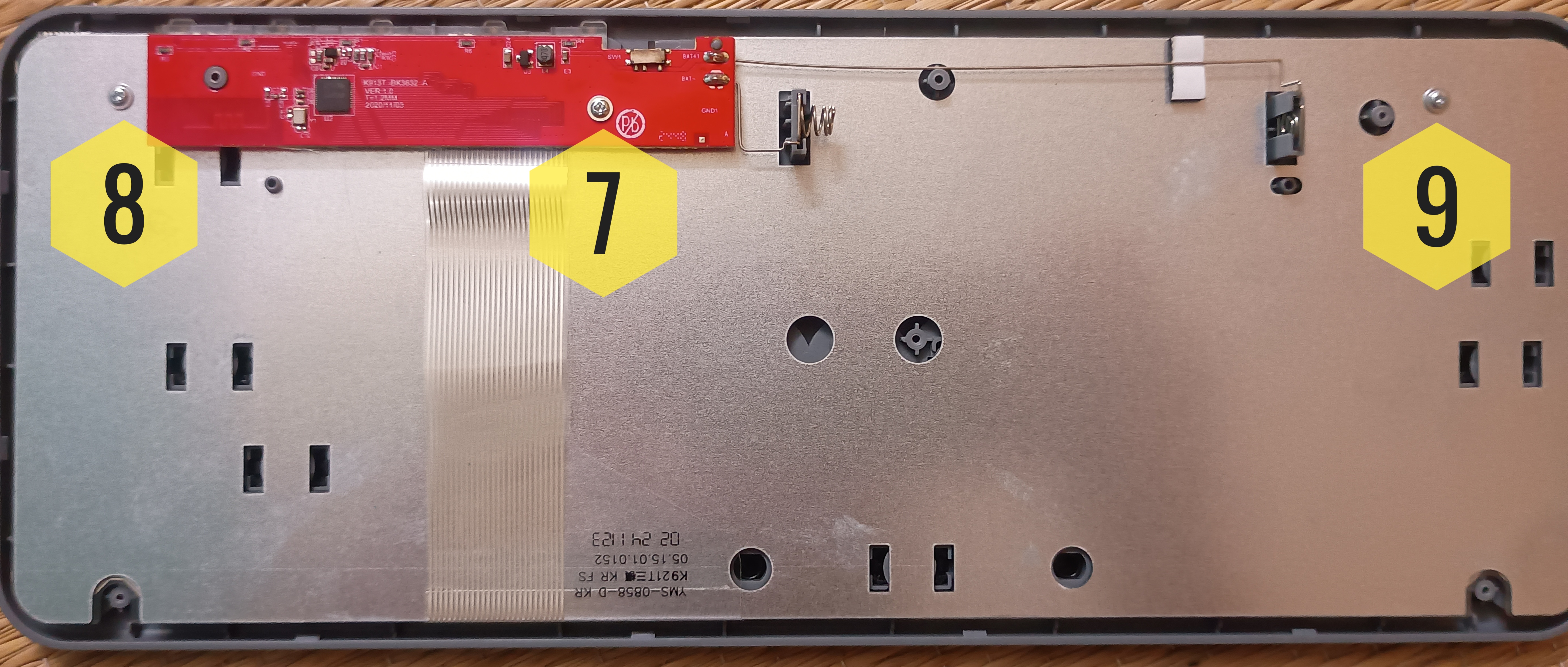 Marked positions of screws 7, 8, and 9 inside the Portronics Bubble 2 keyboard